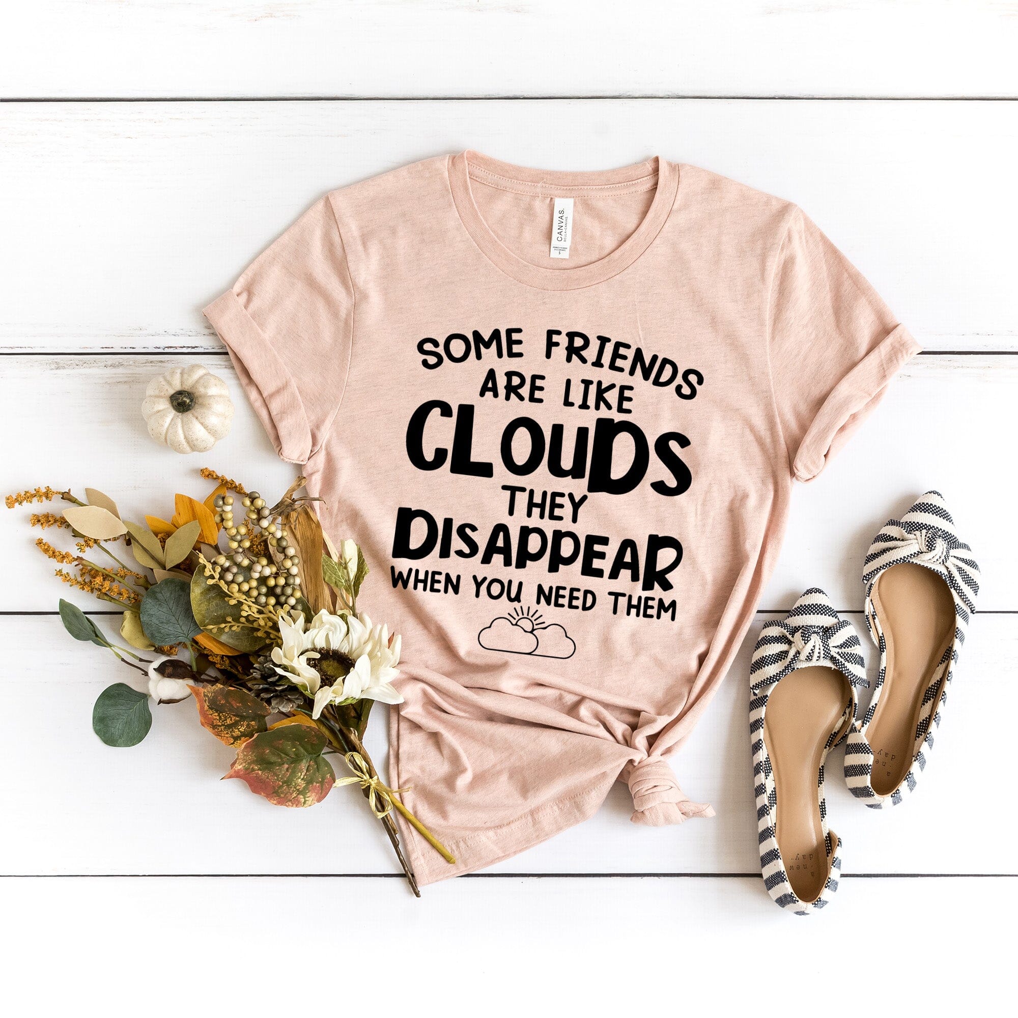 Some Friends Are Like Clouds Tee featuring a stylish design, made from 100% Ringspun Cotton, available in various sizes.