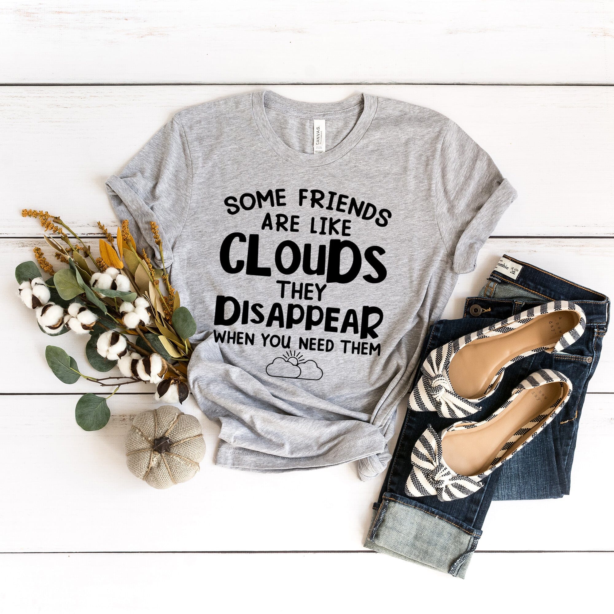 Some Friends Are Like Clouds Tee featuring a stylish design, made from 100% Ringspun Cotton, available in various sizes.