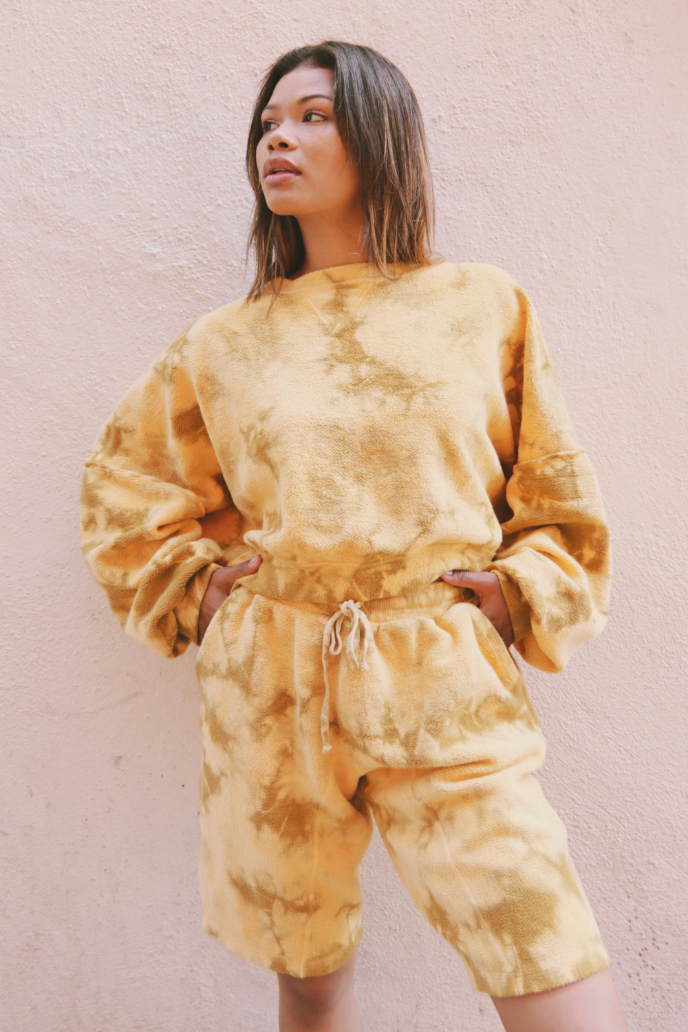 Sophie Tie-Dye Set featuring an oversized cropped sweatshirt and relaxed fit shorts in a vibrant yellow tie-dye pattern.