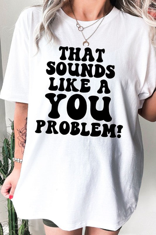 A soft, unisex SOUNDS LIKE A YOU PROBLEM t-shirt made from 100% cotton, featuring a vibrant print and double-stitched hems.