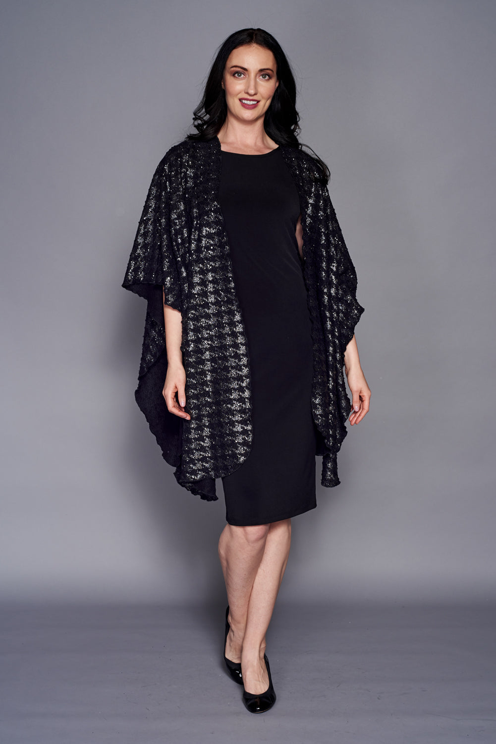 A stylish Sparkle Knit Shawl featuring a houndstooth pattern, perfect for winter evenings.