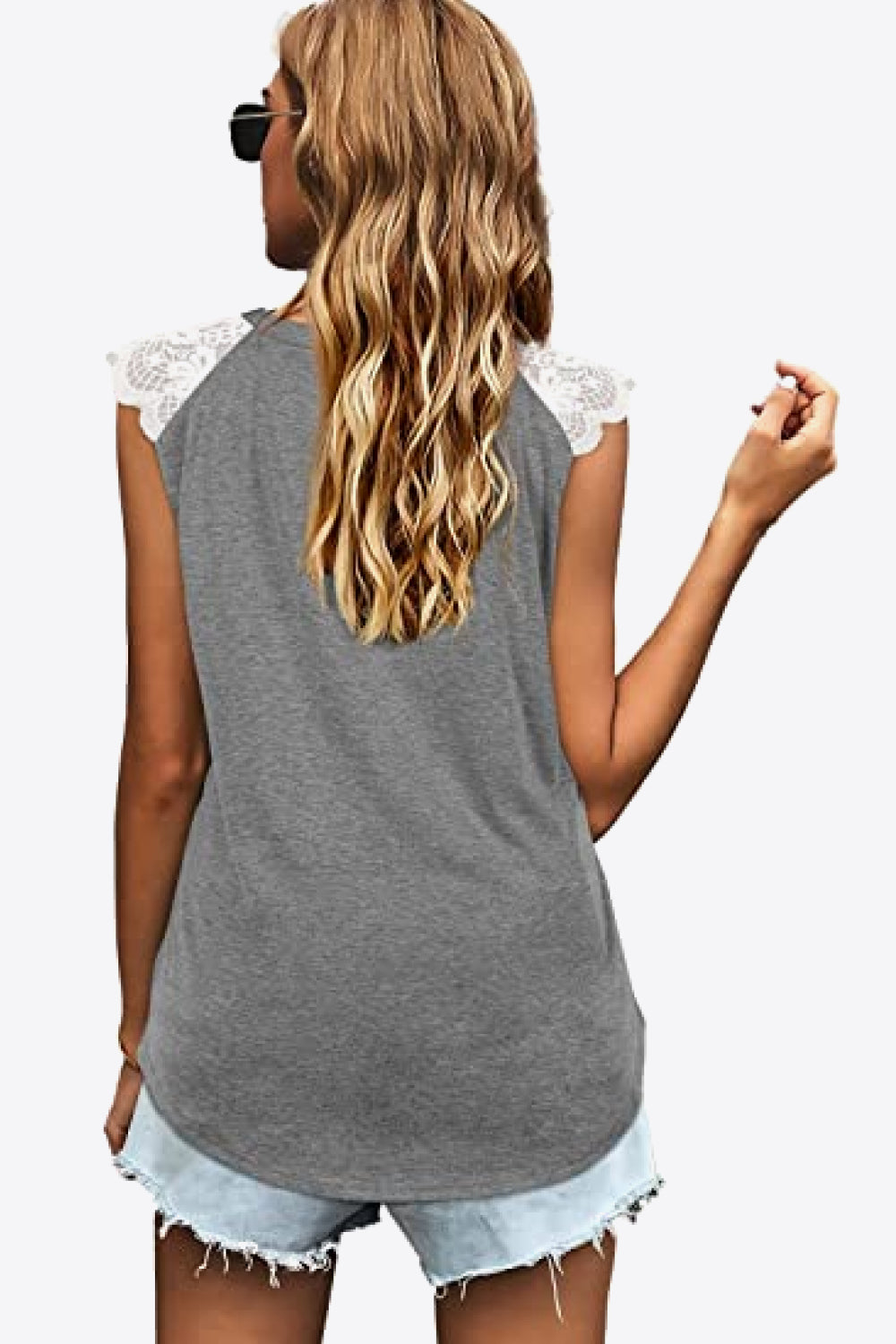 Spliced Lace Curved Hem Blouse featuring a V-neck and cap sleeves, showcasing a stylish design in a solid color.