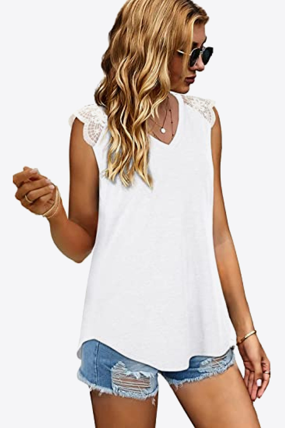 Spliced Lace Curved Hem Blouse featuring a V-neck and cap sleeves, showcasing a stylish design in a solid color.