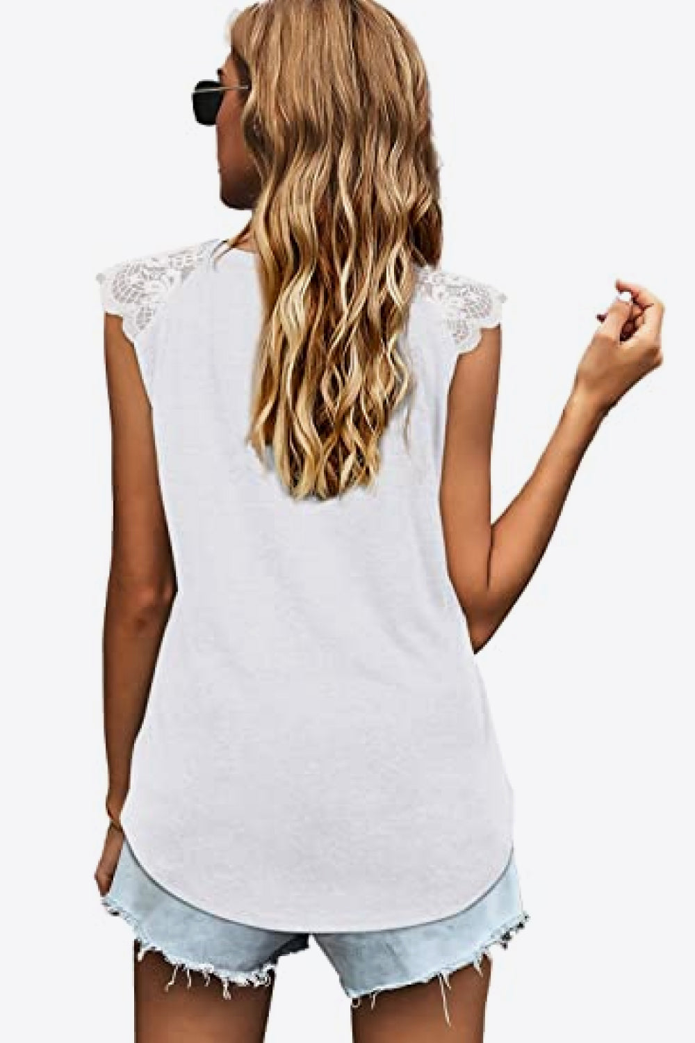 Spliced Lace Curved Hem Blouse featuring a V-neck and cap sleeves, showcasing a stylish design in a solid color.