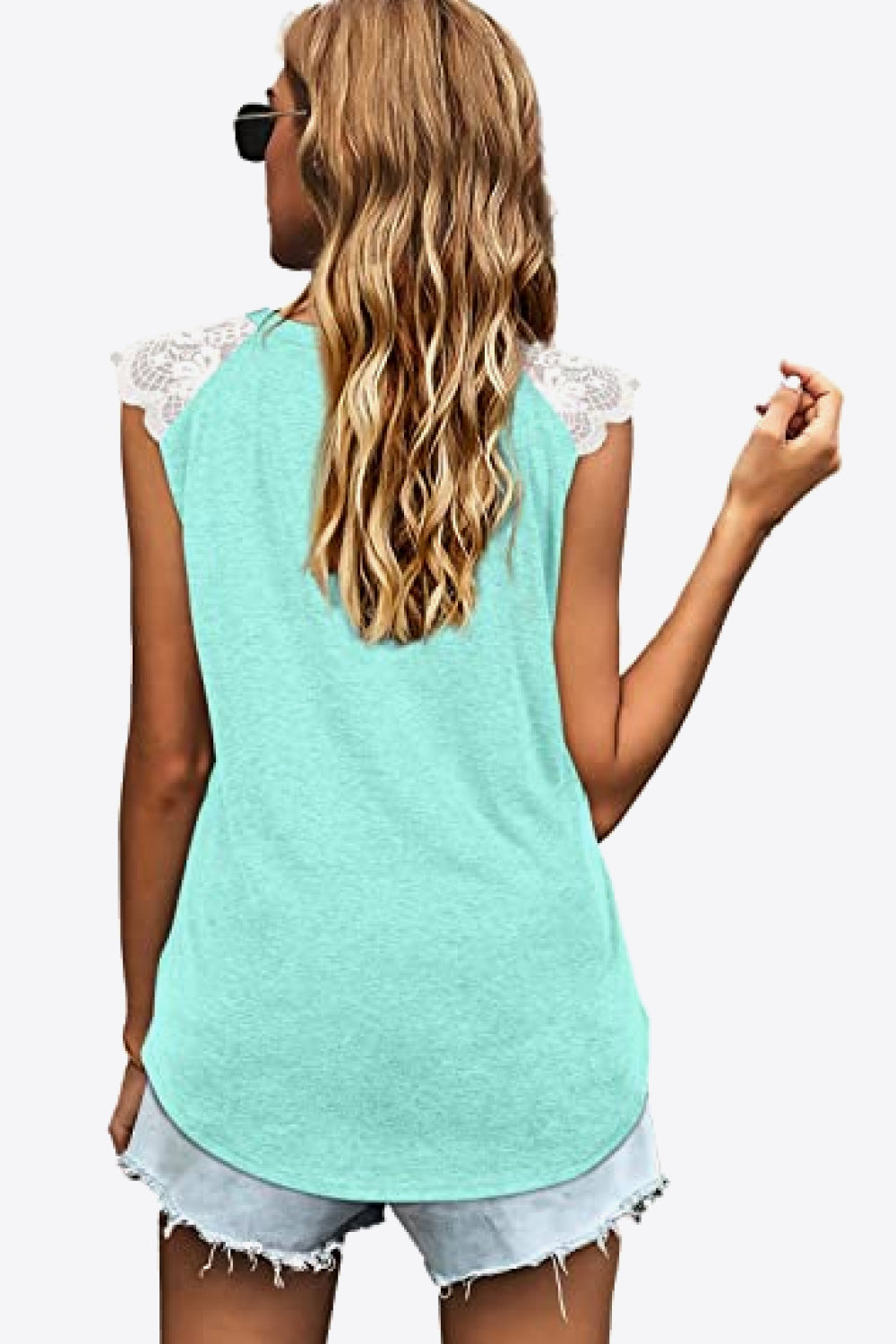 Spliced Lace Curved Hem Blouse featuring a V-neck and cap sleeves, showcasing a stylish design in a solid color.