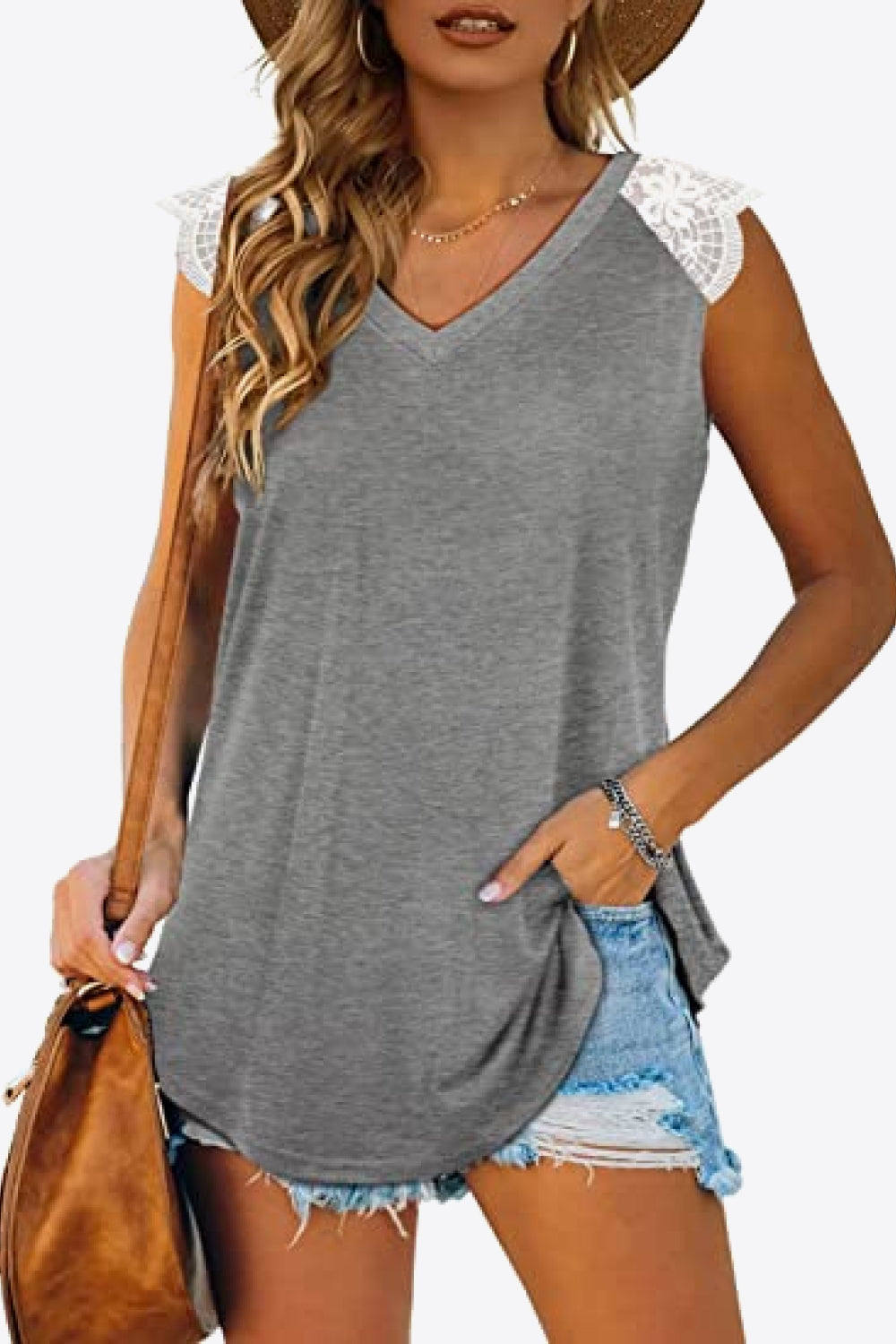 Spliced Lace Curved Hem Blouse featuring a V-neck and cap sleeves, showcasing a stylish design in a solid color.