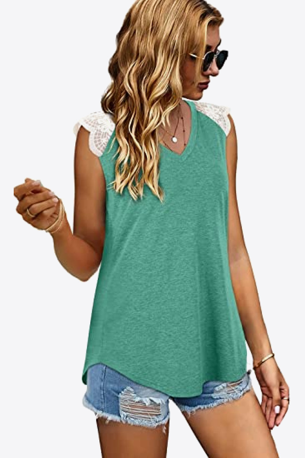 Spliced Lace Curved Hem Blouse featuring a V-neck and cap sleeves, showcasing a stylish design in a solid color.