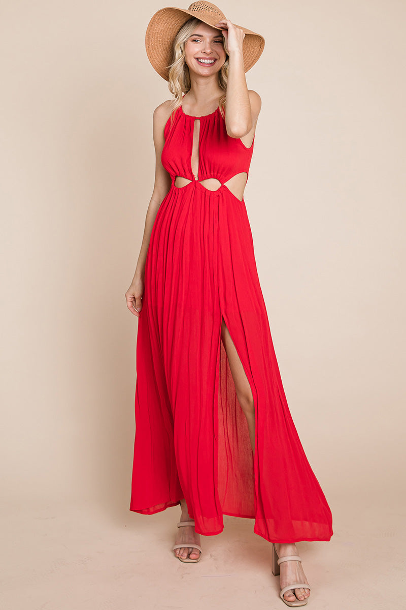 A stylish woman wearing a Split Front Cut Out Halter Maxi Dress, showcasing the elegant design and flattering silhouette.