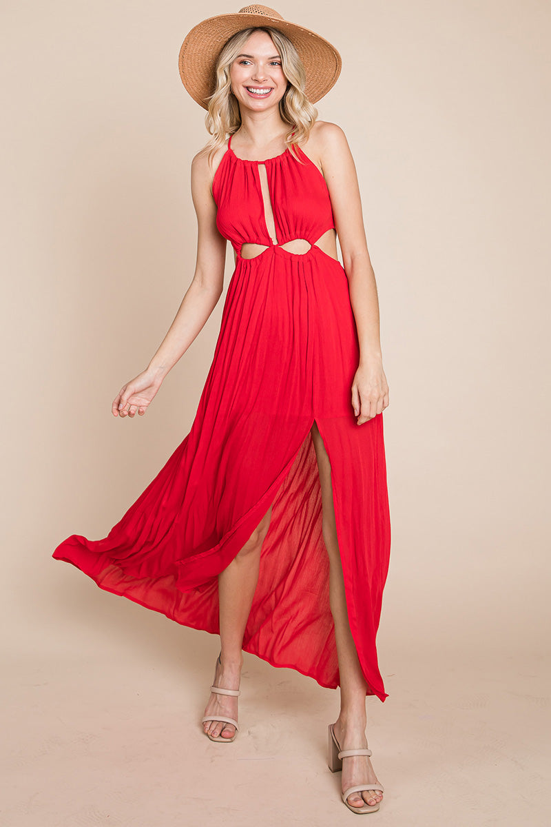 A stylish woman wearing a Split Front Cut Out Halter Maxi Dress, showcasing the elegant design and flattering silhouette.