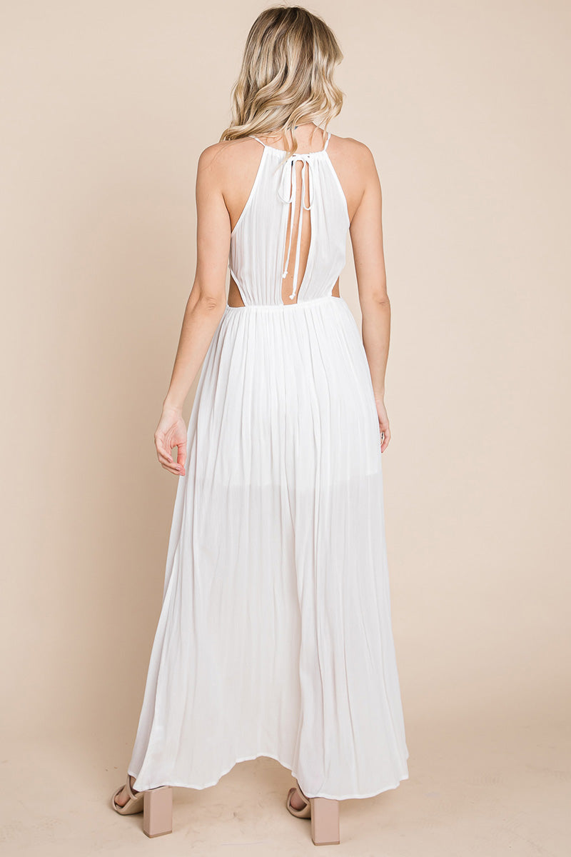 A stylish woman wearing a Split Front Cut Out Halter Maxi Dress, showcasing the elegant design and flattering silhouette.