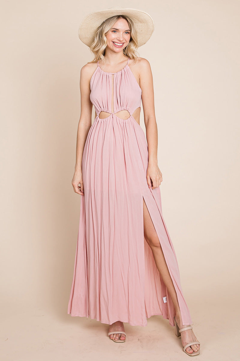 A stylish woman wearing a Split Front Cut Out Halter Maxi Dress, showcasing the elegant design and flattering silhouette.