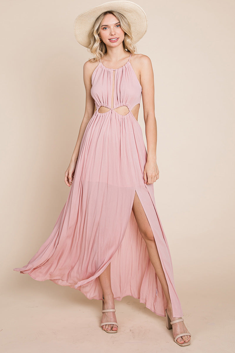 A stylish woman wearing a Split Front Cut Out Halter Maxi Dress, showcasing the elegant design and flattering silhouette.