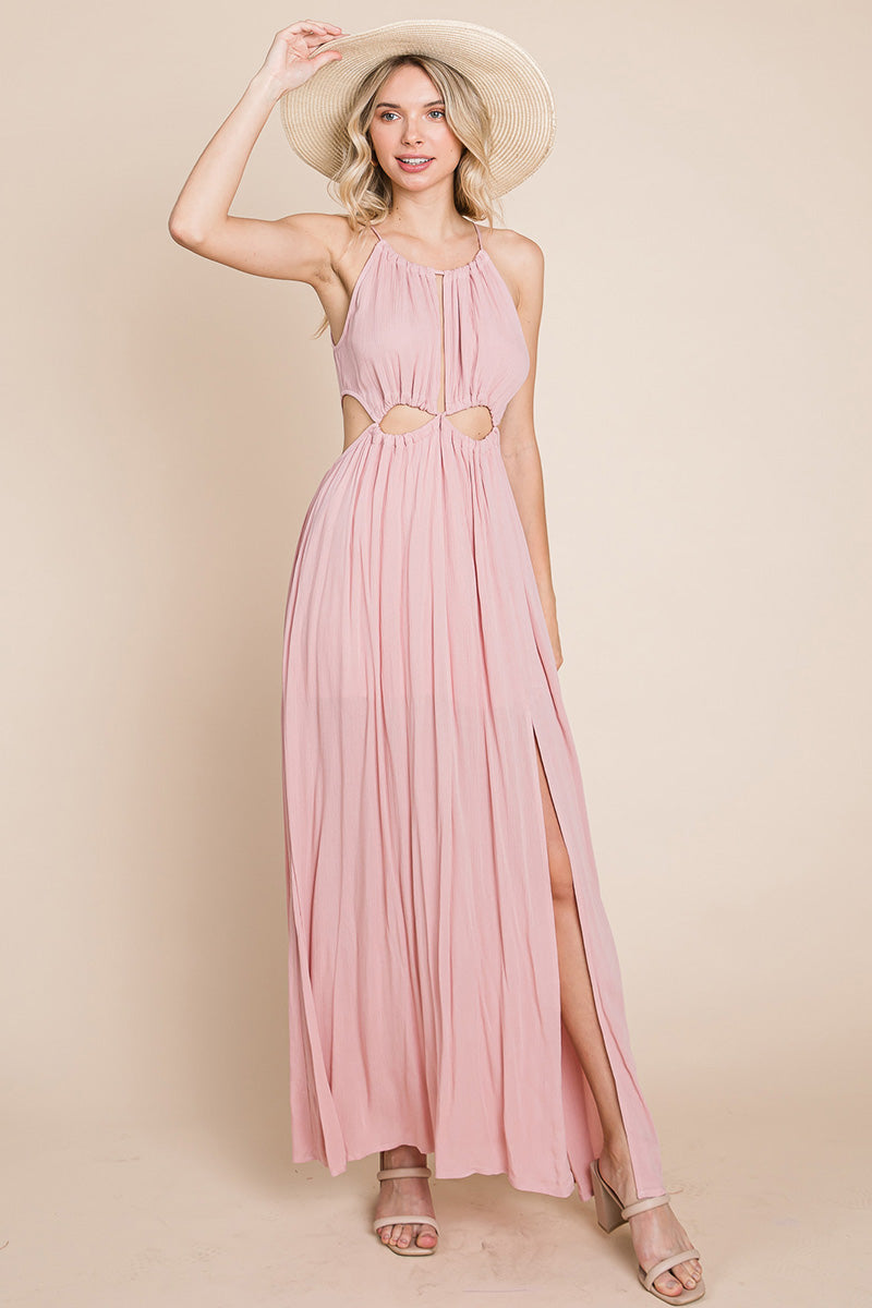 A stylish woman wearing a Split Front Cut Out Halter Maxi Dress, showcasing the elegant design and flattering silhouette.