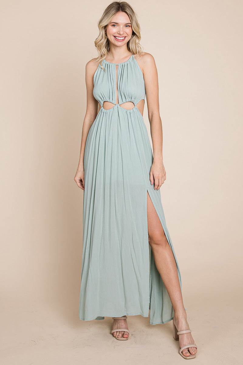 A stylish woman wearing a Split Front Cut Out Halter Maxi Dress, showcasing the elegant design and flattering silhouette.