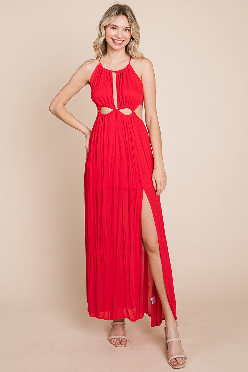 A stylish woman wearing a Split Front Cut Out Halter Maxi Dress, showcasing the elegant design and flattering silhouette.