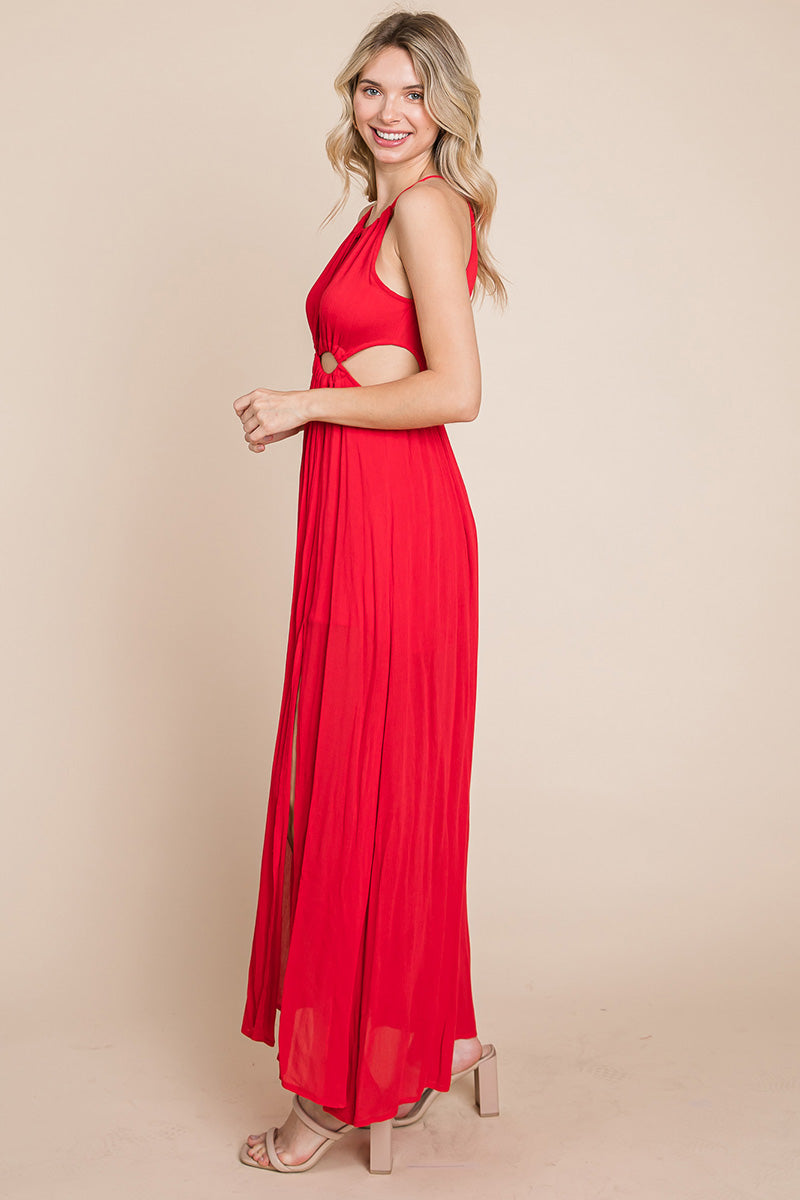 A stylish woman wearing a Split Front Cut Out Halter Maxi Dress, showcasing the elegant design and flattering silhouette.