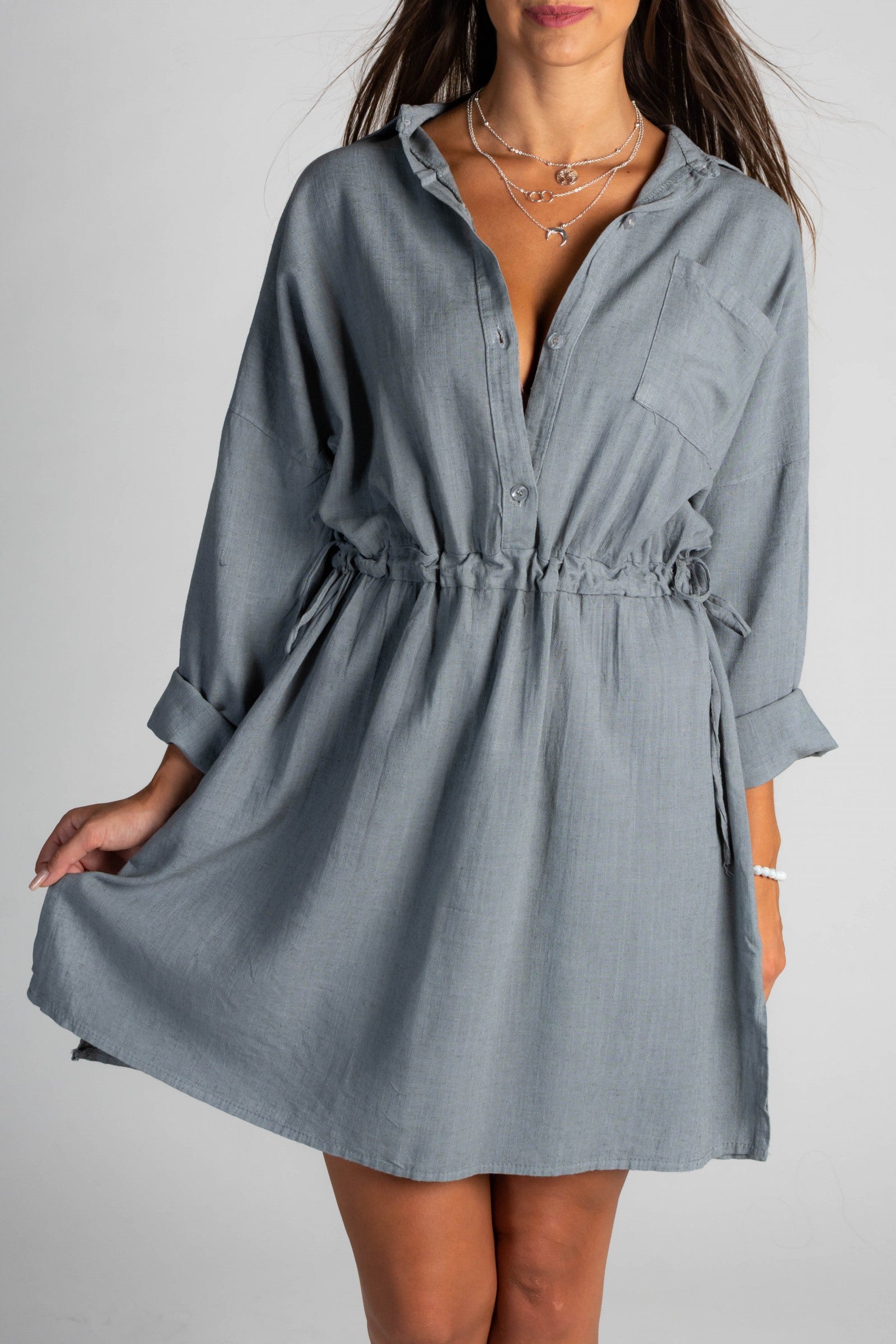 Gray SPORT MINI DRESS featuring a classic collar, long sleeves, and a decorative front pocket, designed for comfort and style.