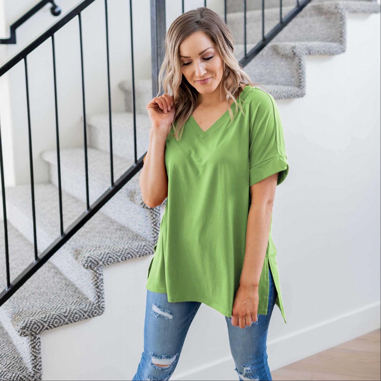 Sporty V-Neck Tee in various colors with slits at hips and hemmed sleeves, showcasing a relaxed fit and stylish design.