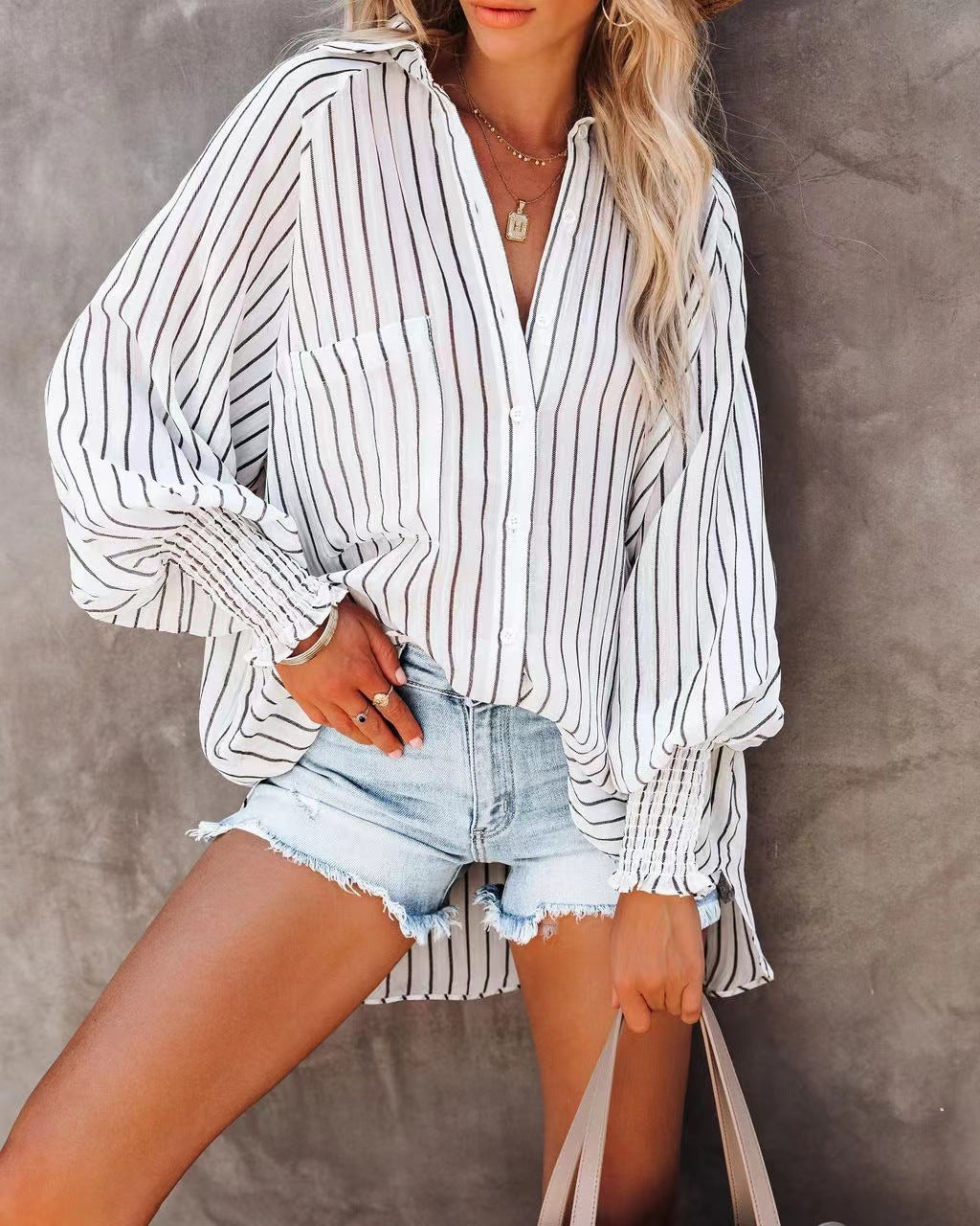 A stylish striped lapel shirt featuring long lantern sleeves, made from a cotton and polyester blend, perfect for casual wear in spring and autumn.