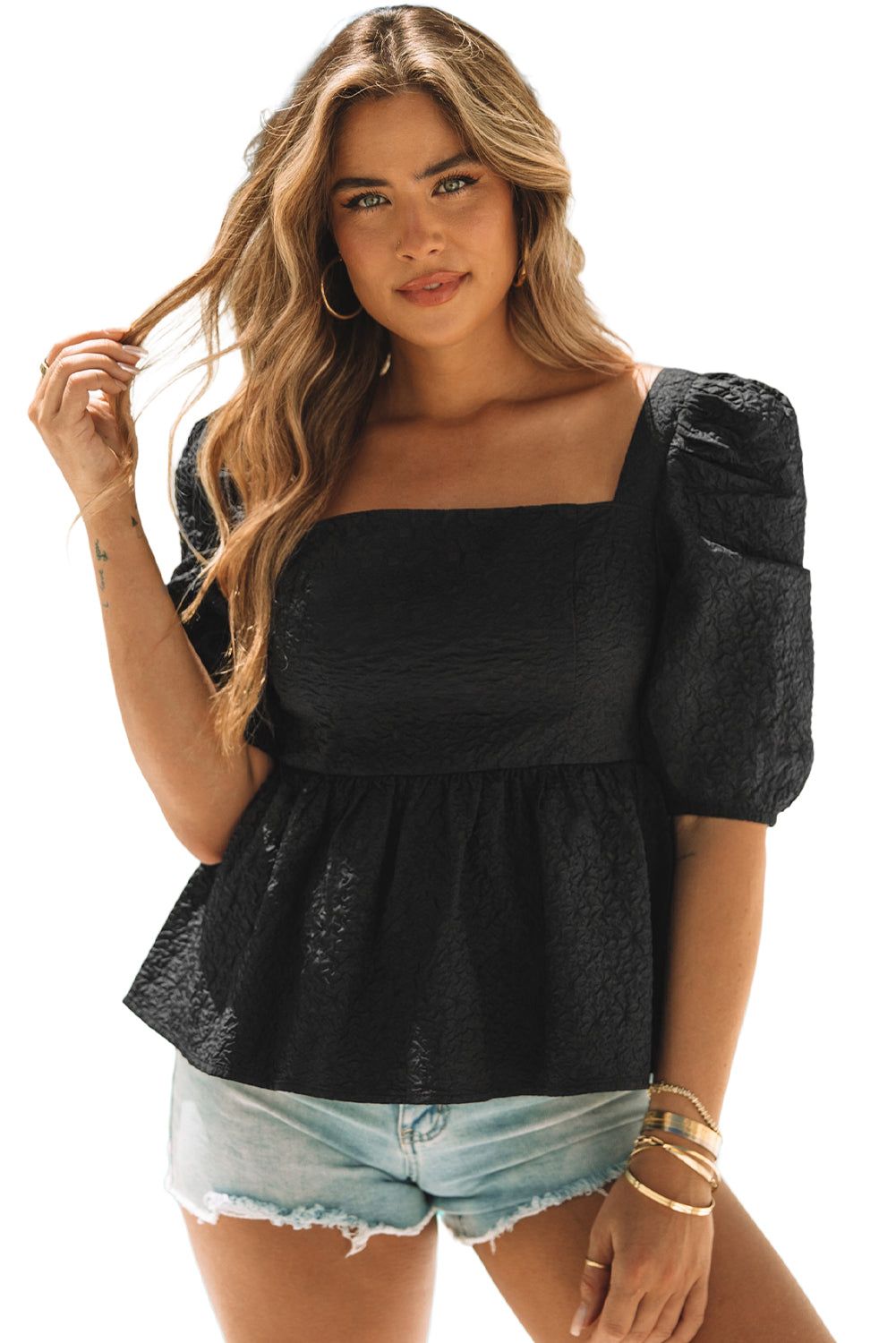 A stylish square neck blouse with puff sleeves, featuring a peplum design, perfect for casual and formal occasions.