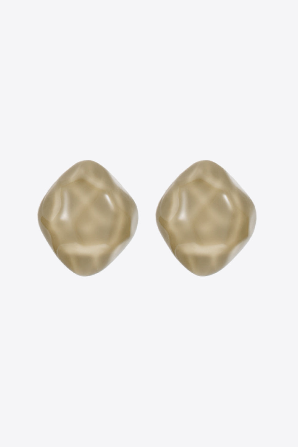 A pair of Stand Out Irregular Resin Stud Earrings featuring a minimalist design with a polished finish, set against a flat lay background.