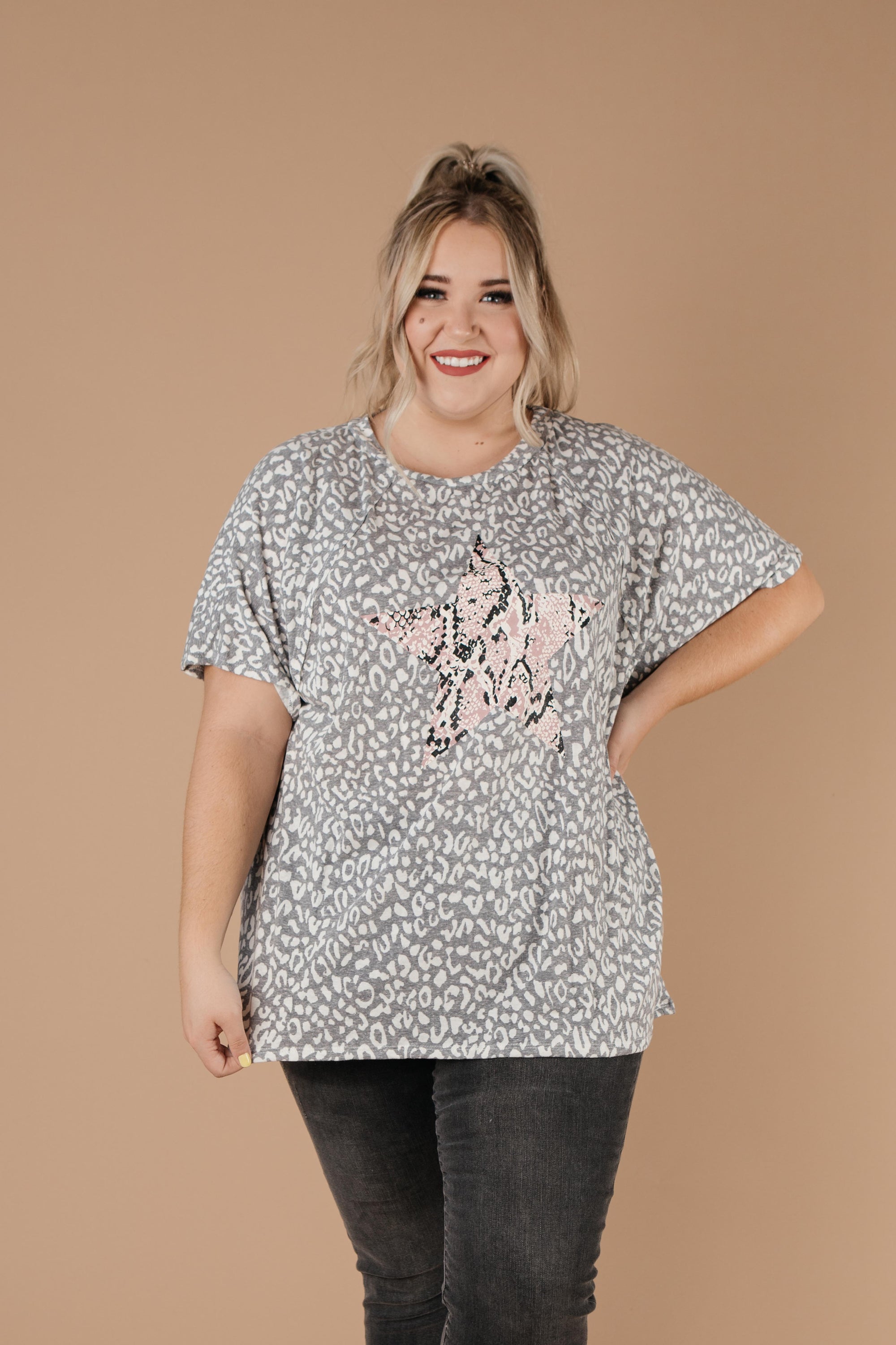 Star Of The Animal Show Top in Charcoal featuring leopard and snake prints, round neckline, and short sleeves.