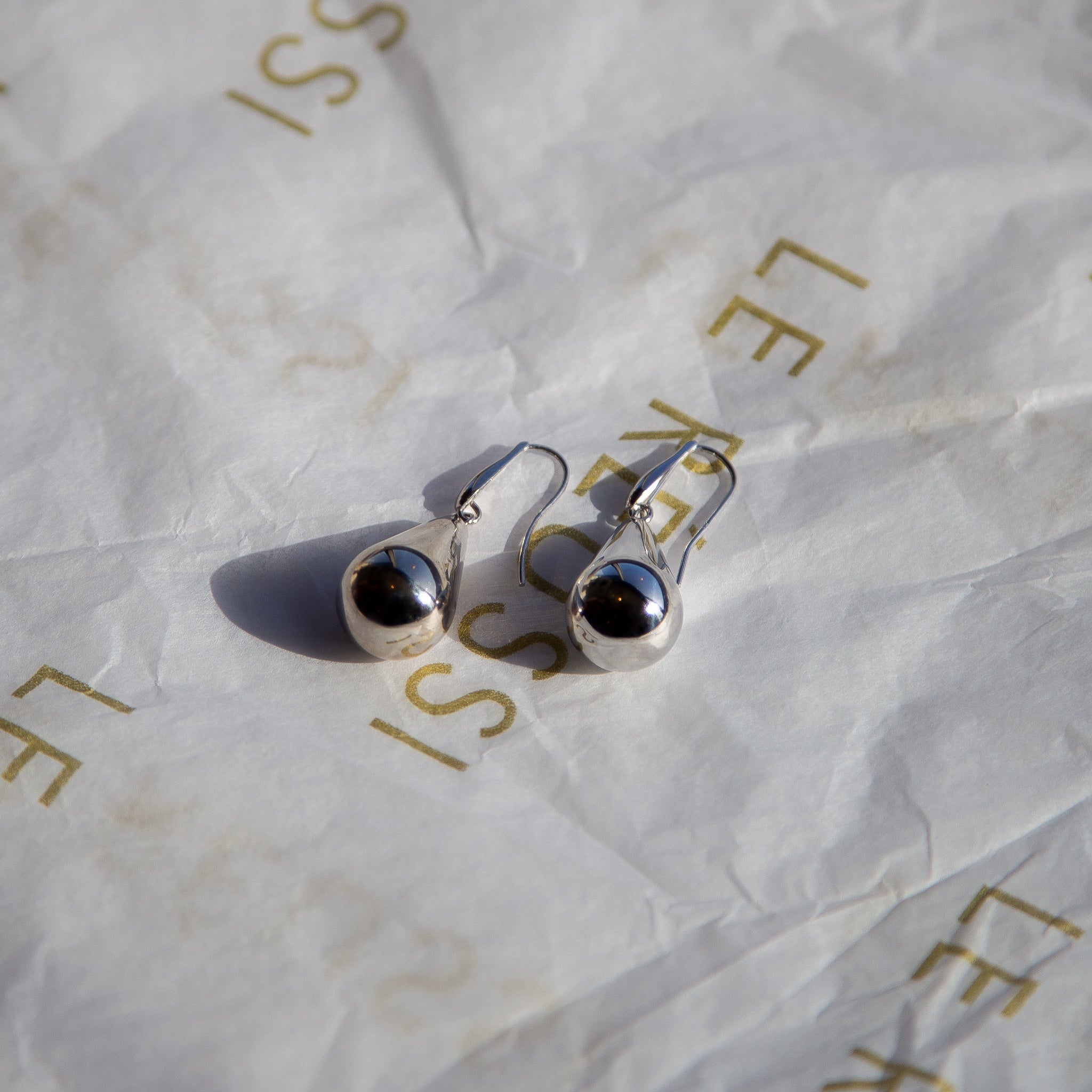 Elegant sterling silver earrings in raindrop design, handcrafted in Italy.