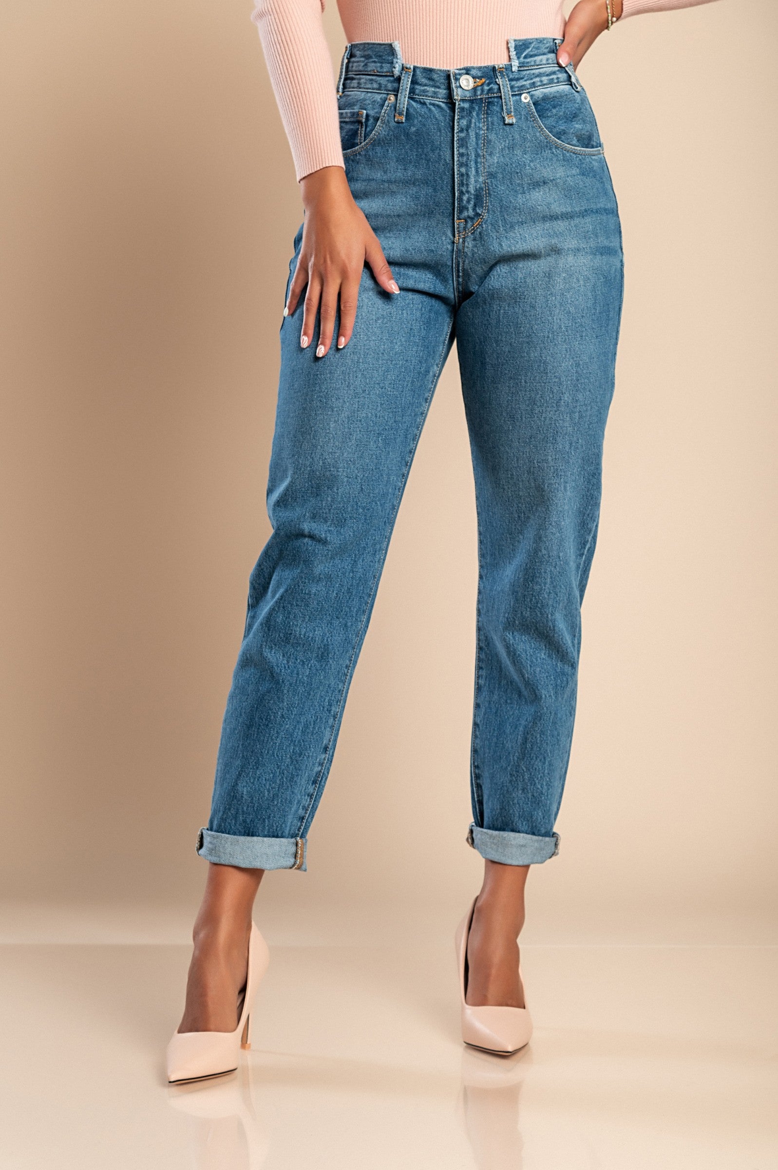 A pair of blue straight jeans made from high-quality cotton, featuring a high waist, zip and button closure, and front and back pockets.