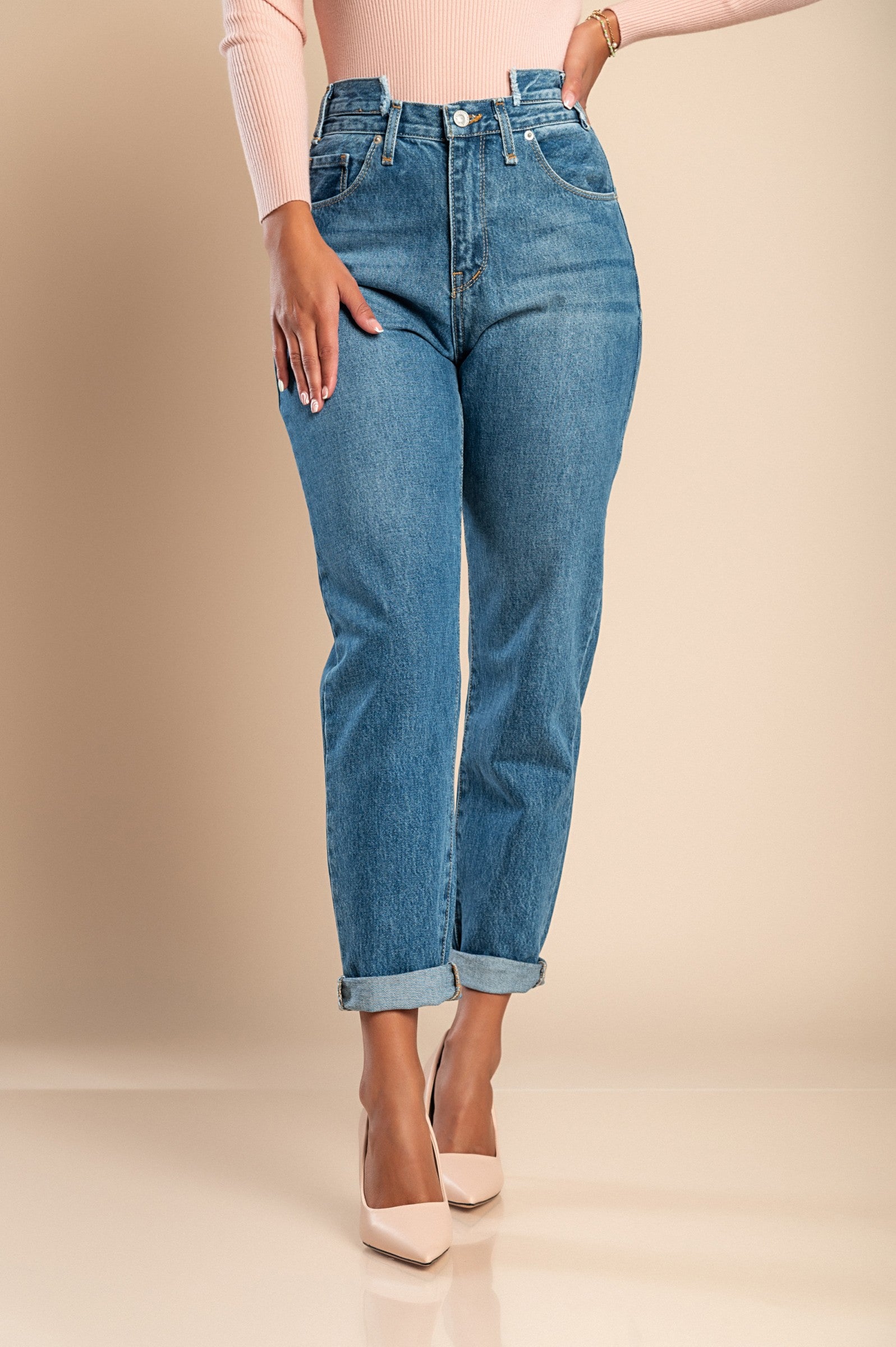 A pair of blue straight jeans made from high-quality cotton, featuring a high waist, zip and button closure, and front and back pockets.