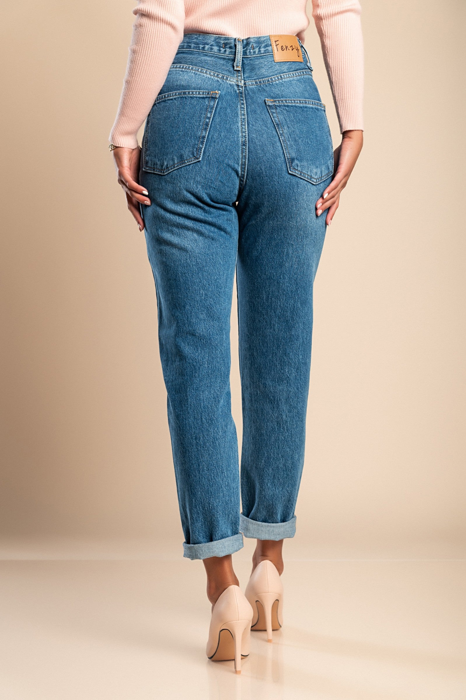 A pair of blue straight jeans made from high-quality cotton, featuring a high waist, zip and button closure, and front and back pockets.