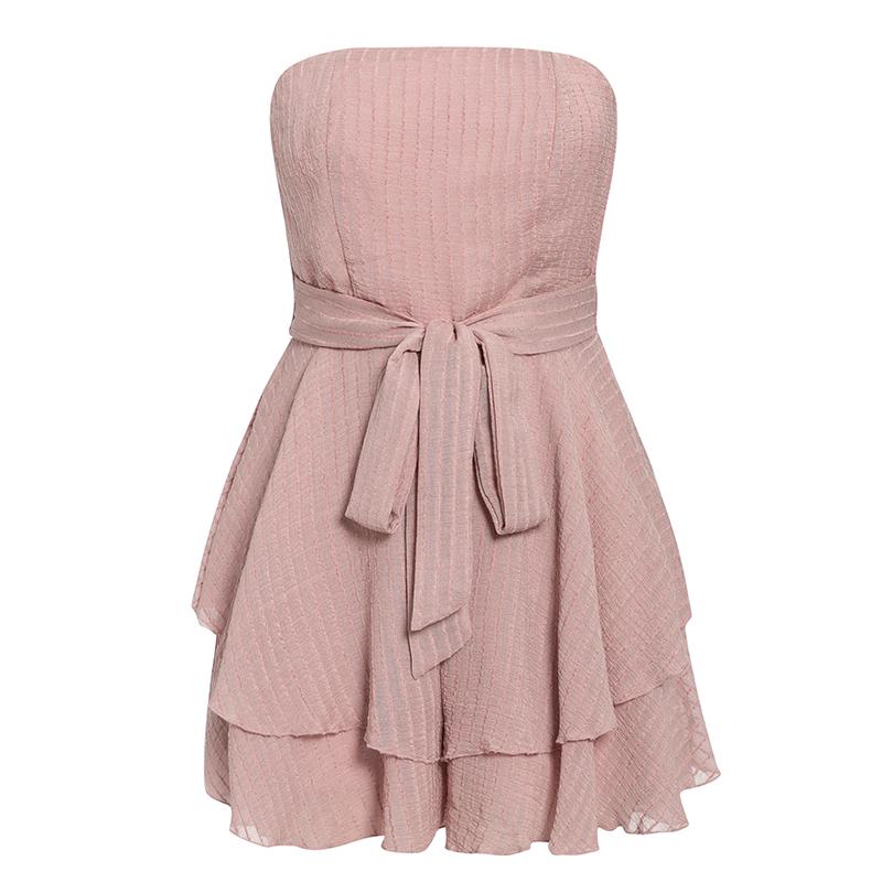 Stylish strapless women playsuit with ruffles, featuring a loose fit and multi-layer design, perfect for beach outings.