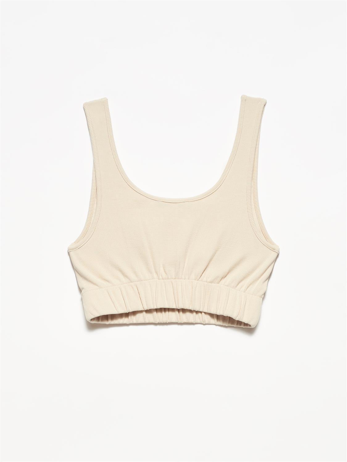 A stylish strappy top made from 96% cotton and 4% elastane, featuring thin straps and a comfortable fit.