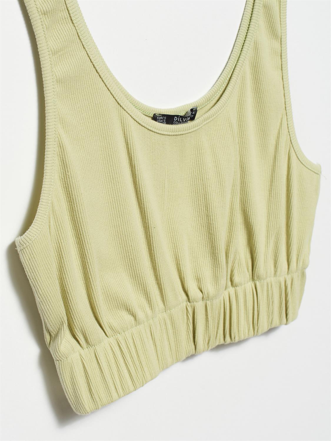 A stylish strappy top made from 96% cotton and 4% elastane, featuring thin straps and a comfortable fit.