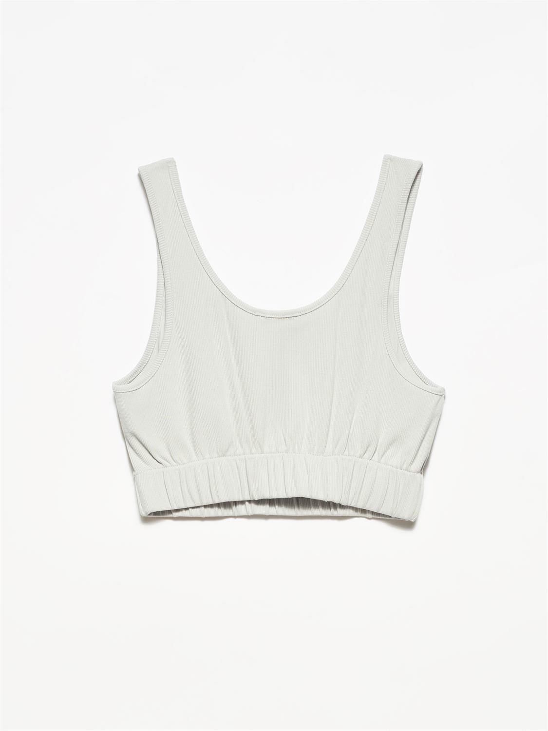 A stylish strappy top made from 96% cotton and 4% elastane, featuring thin straps and a comfortable fit.