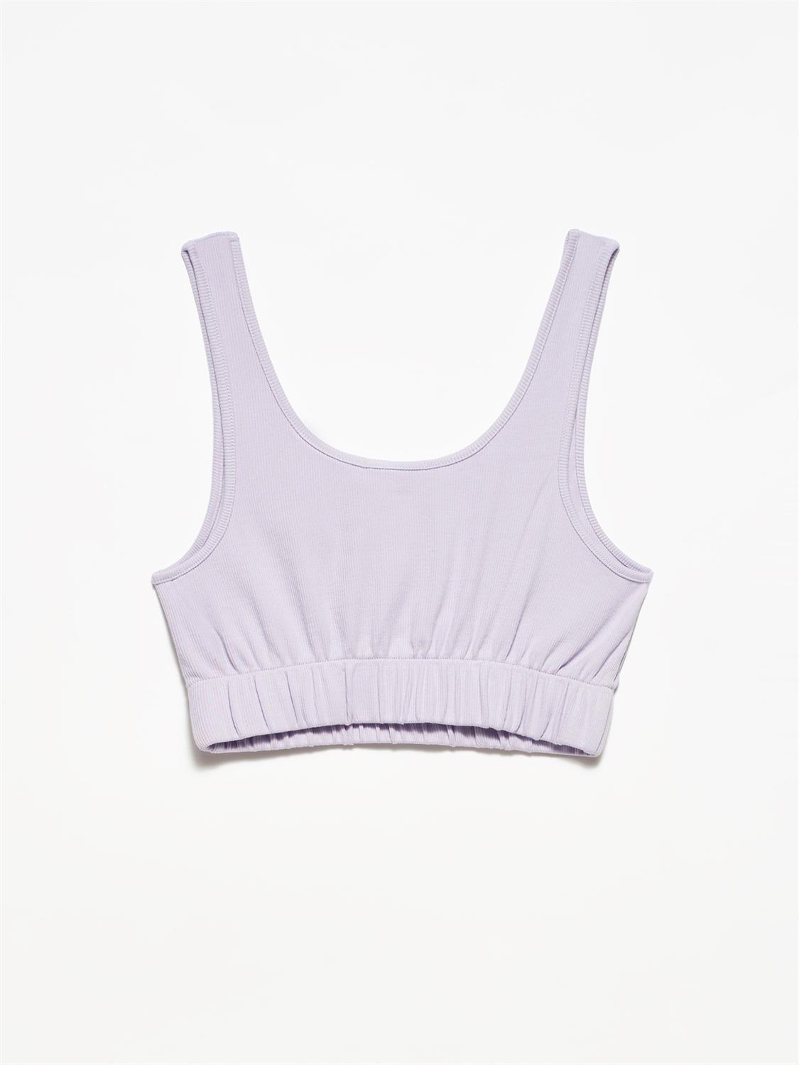 A stylish strappy top made from 96% cotton and 4% elastane, featuring thin straps and a comfortable fit.