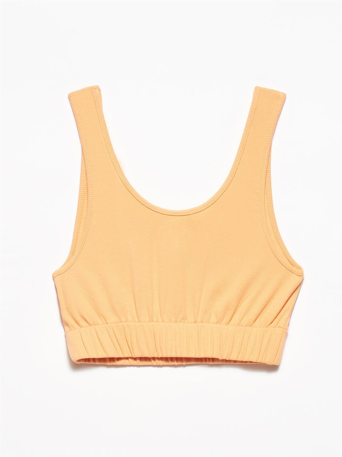 A stylish strappy top made from 96% cotton and 4% elastane, featuring thin straps and a comfortable fit.