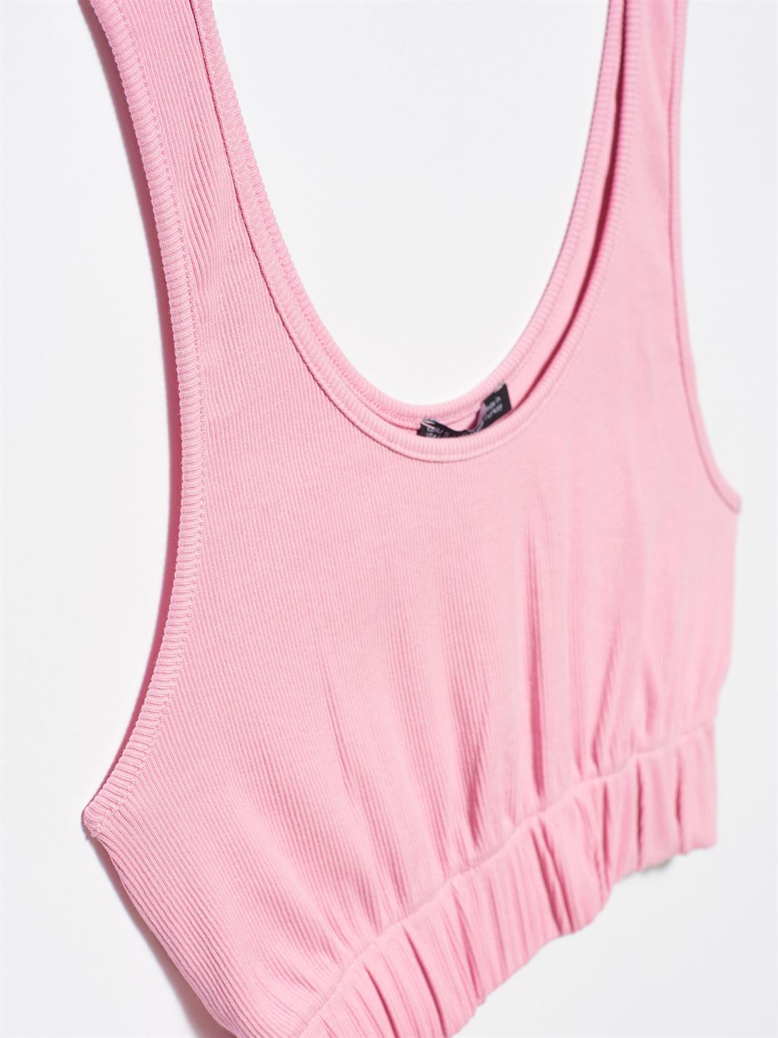 A stylish strappy top made from 96% cotton and 4% elastane, featuring thin straps and a comfortable fit.