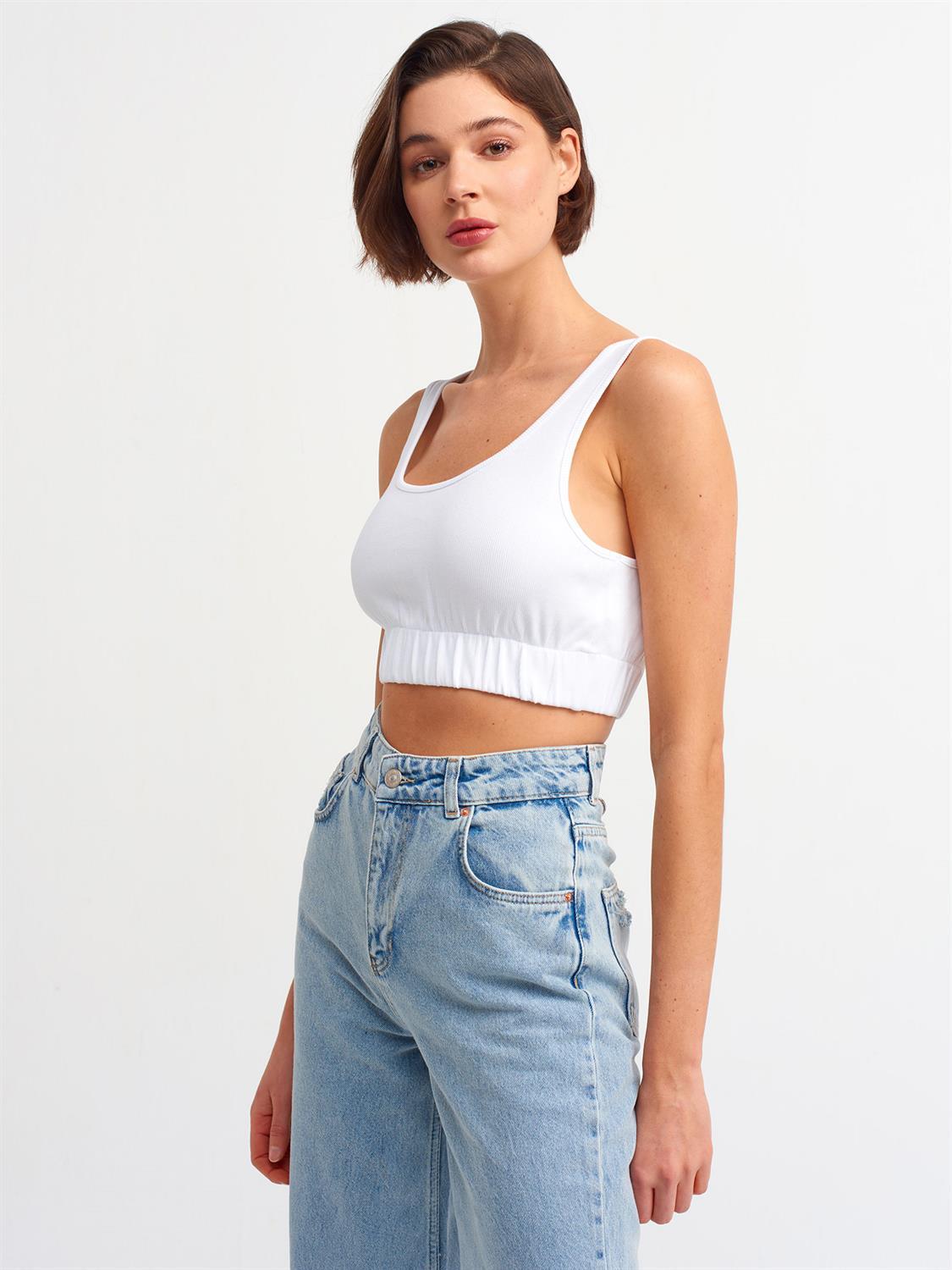 A stylish strappy top made from 96% cotton and 4% elastane, featuring thin straps and a comfortable fit.