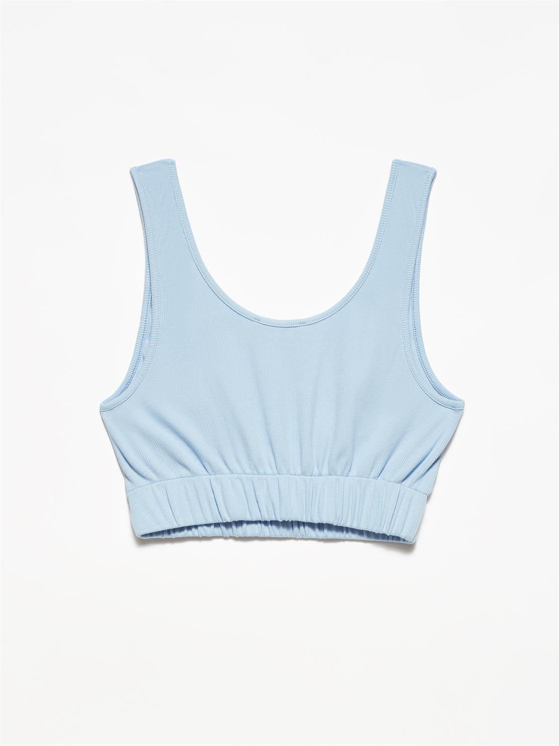 A stylish strappy top made from 96% cotton and 4% elastane, featuring thin straps and a comfortable fit.