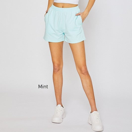 A pair of Stretch Terry Basic Elastic Waistband Sweatshorts in a vibrant color, showcasing the soft French Terry fabric and elastic waistband.