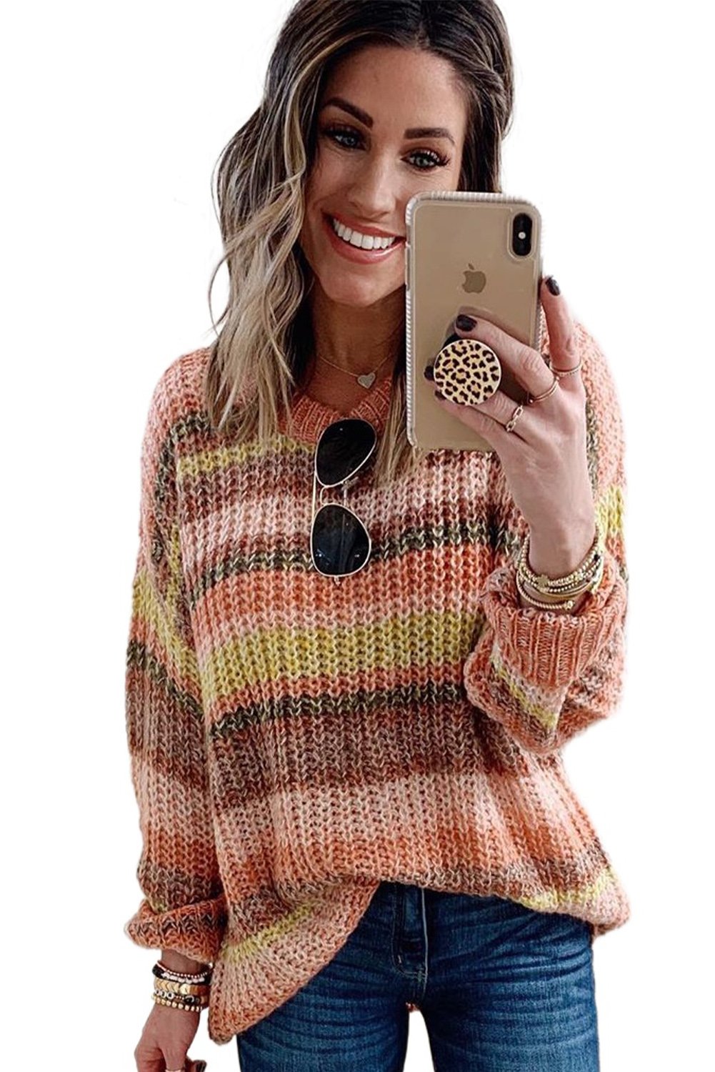 A vibrant Stripe Color Block Chunky Sweater featuring a mix of cream, pink, orange, yellow, and red stripes, showcasing a relaxed fit and long sleeves.