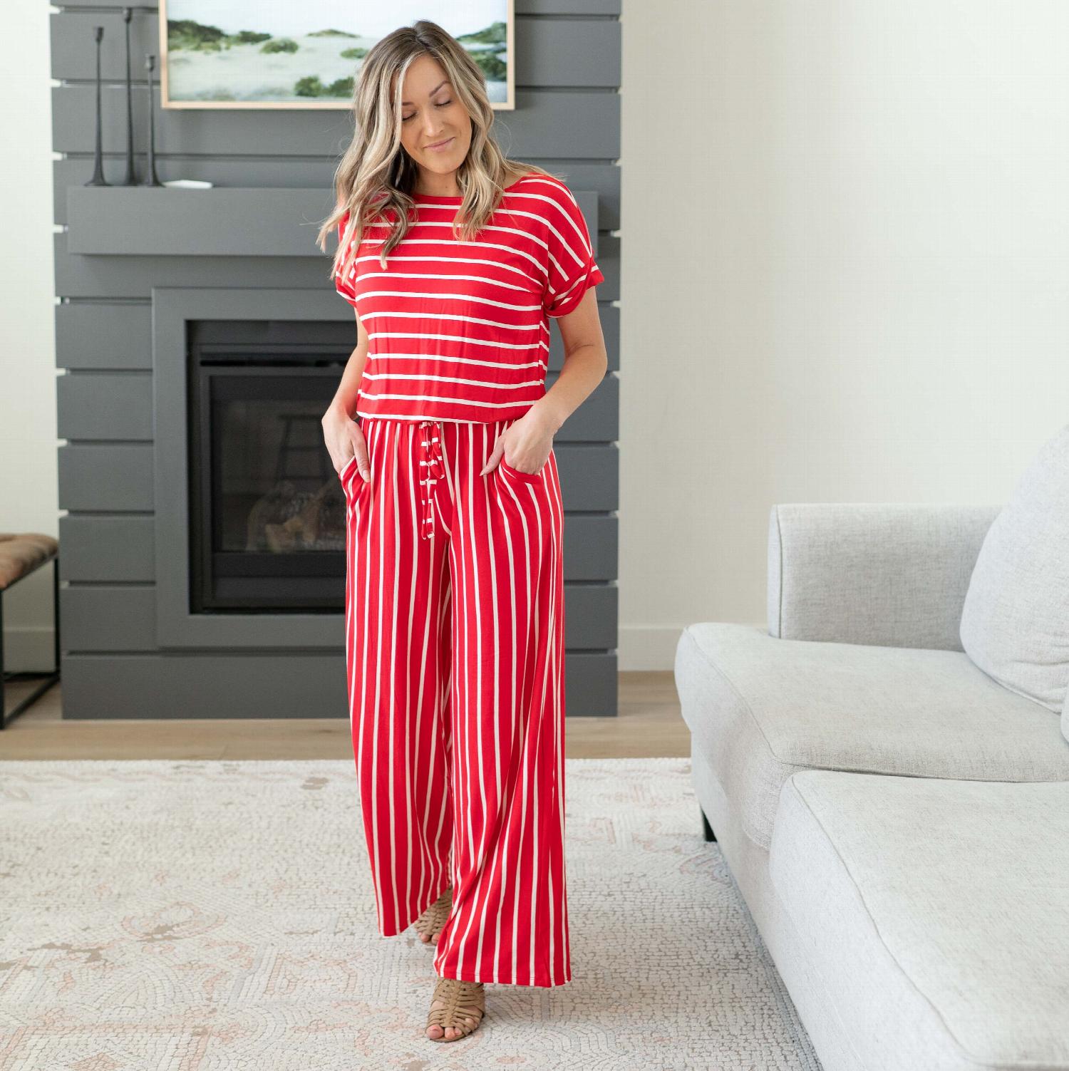 A stylish Stripe Jumpsuit featuring an elastic waist and back keyhole detail, perfect for casual outings and lounging.