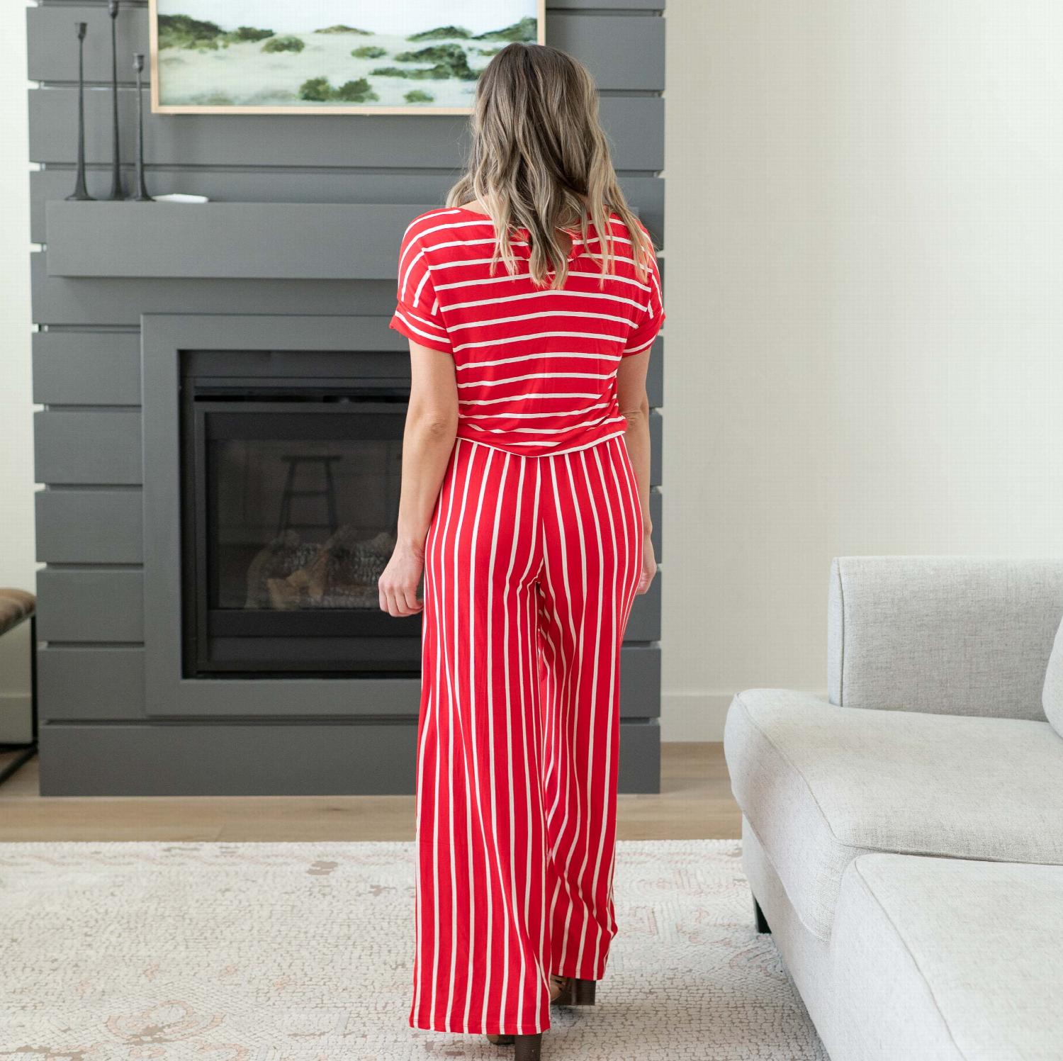 A stylish Stripe Jumpsuit featuring an elastic waist and back keyhole detail, perfect for casual outings and lounging.