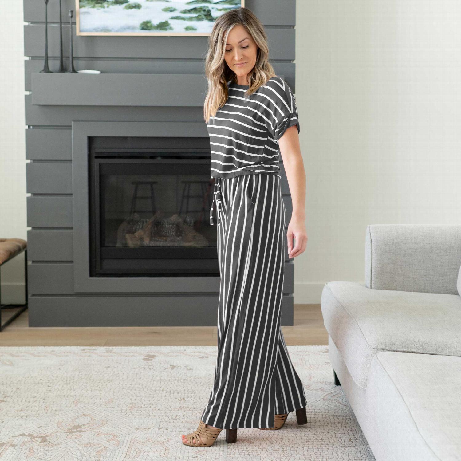 A stylish Stripe Jumpsuit featuring an elastic waist and back keyhole detail, perfect for casual outings and lounging.