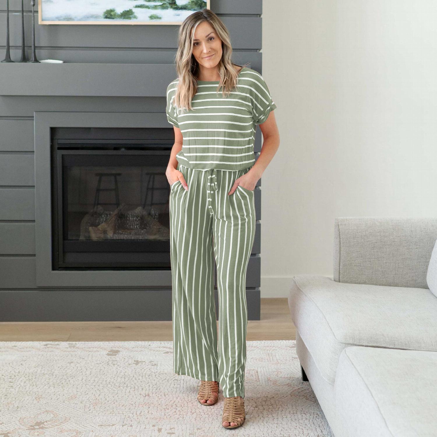 A stylish Stripe Jumpsuit featuring an elastic waist and back keyhole detail, perfect for casual outings and lounging.