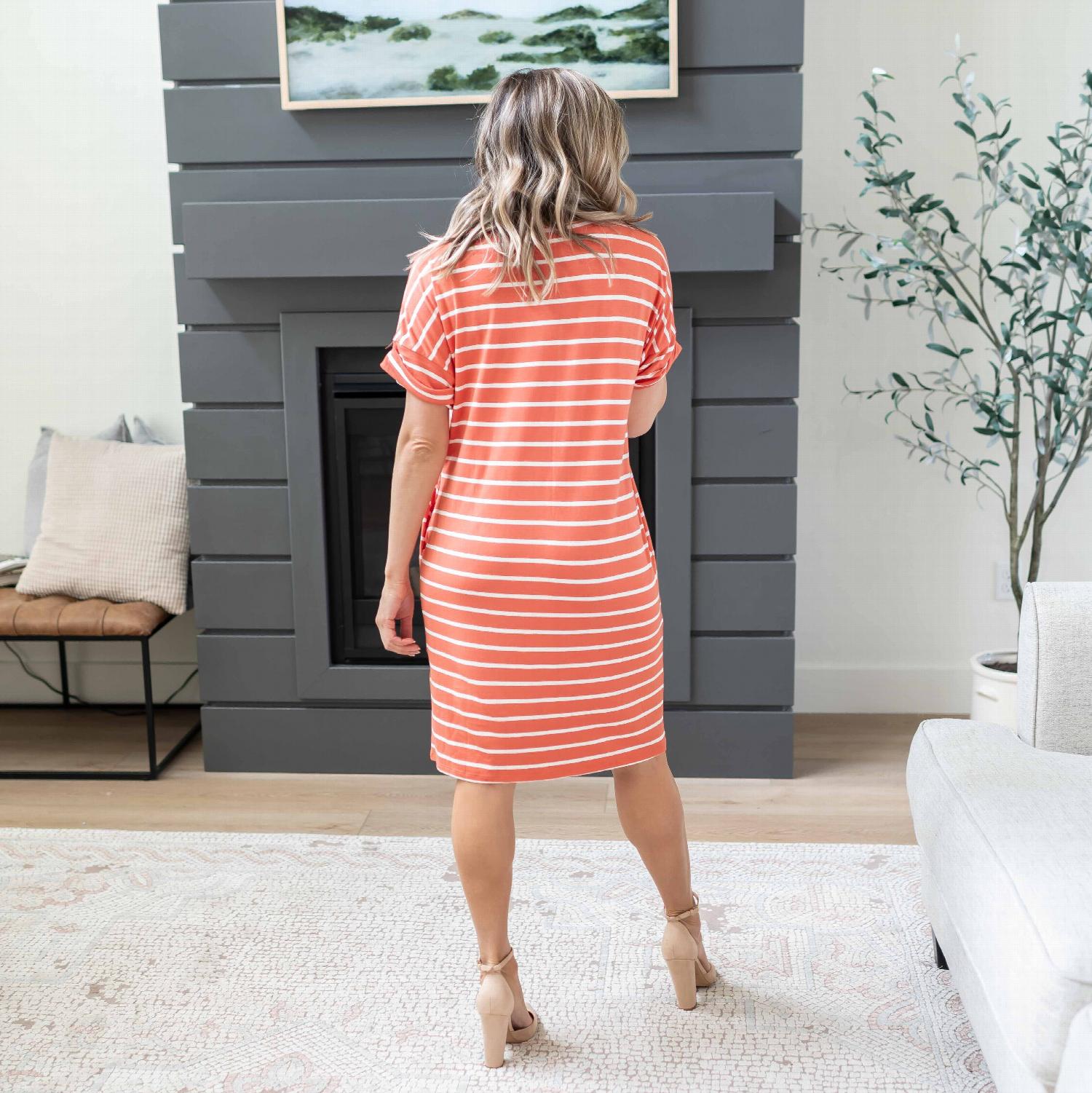 A stylish Stripe Rolled Short Sleeve V-neck Dress featuring a chic striped pattern, rolled short sleeves, and a flattering V-neck design.