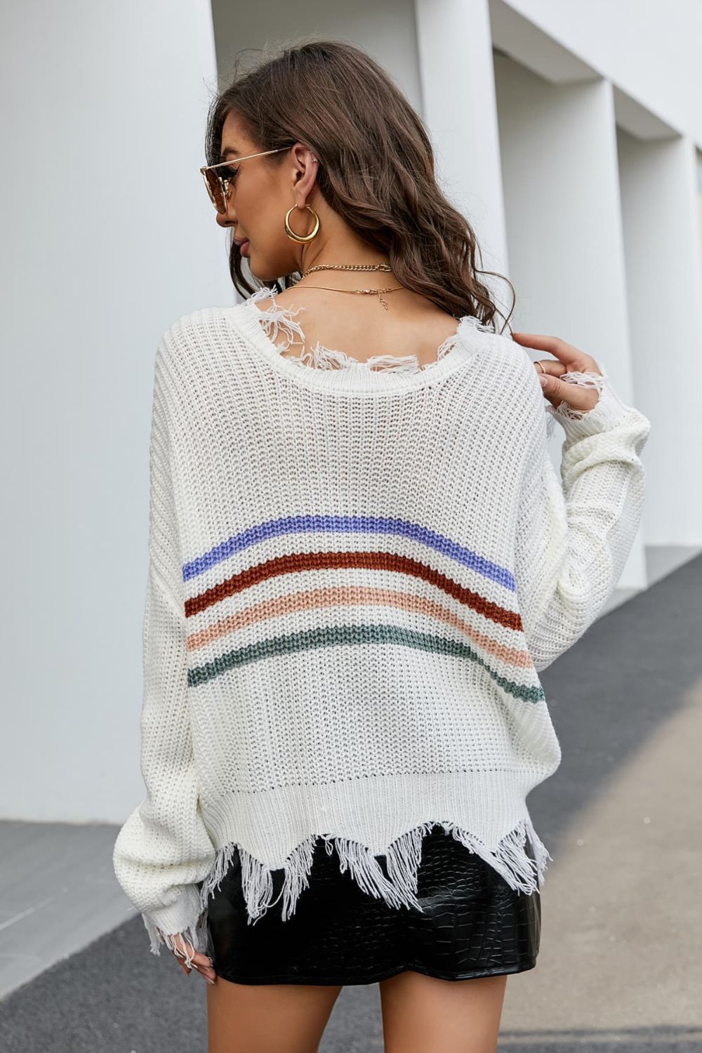 Striped Distressed Fringe Trim Plunge Sweater in studio setting, showcasing its V-neck design and long sleeves.