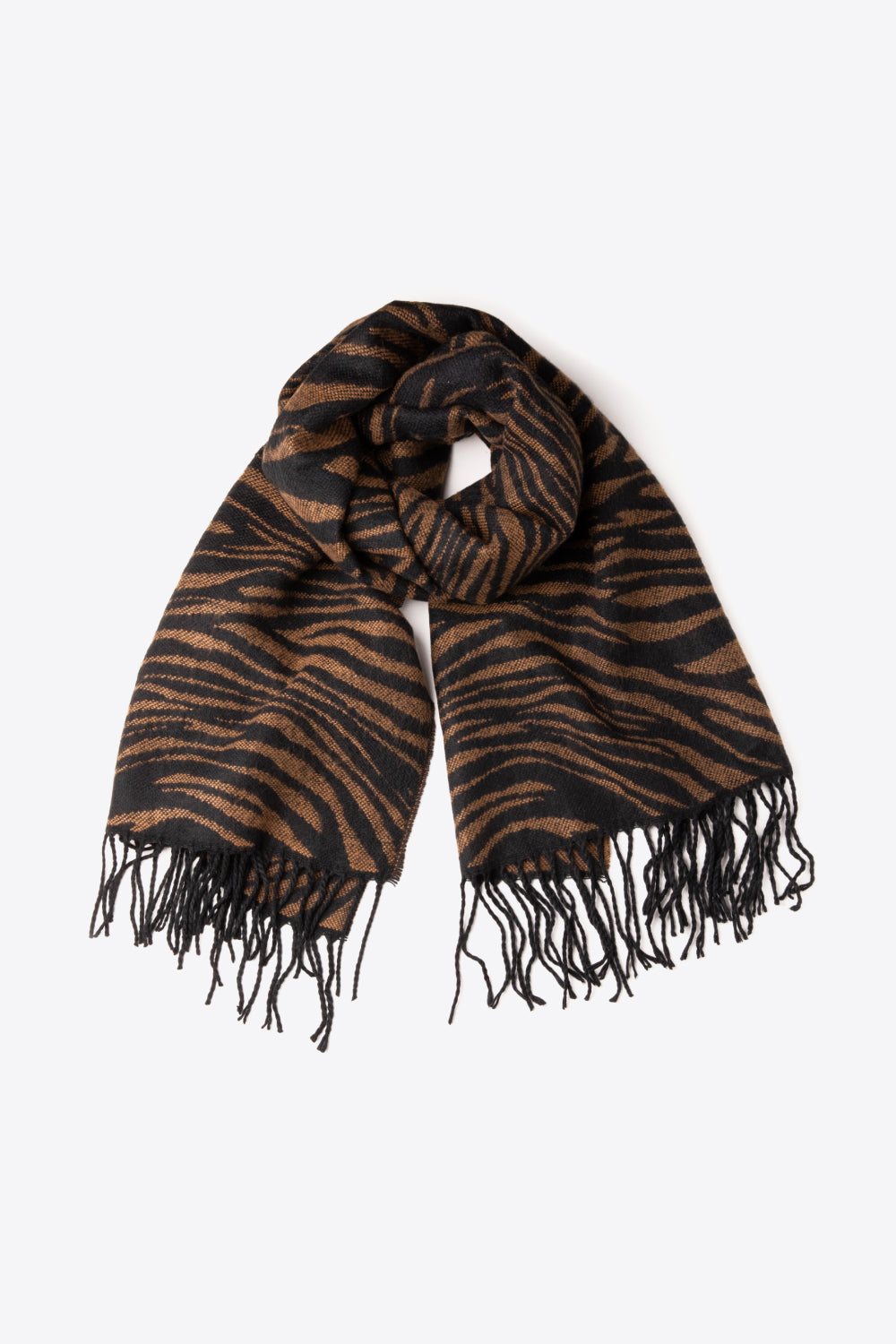 A stylish striped fringe trim scarf laid flat, showcasing its soft acrylic material and vibrant colors.