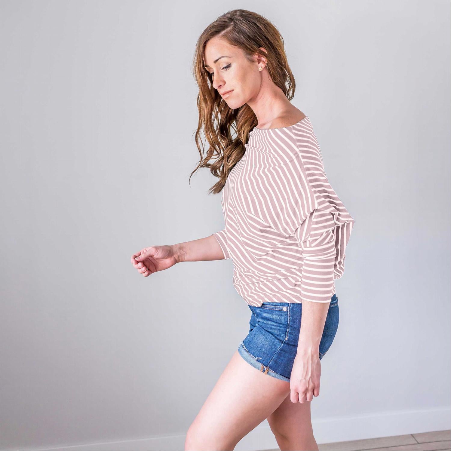 A stylish striped longsleeve off shoulder top featuring a boat neck design, long sleeves, and a comfortable fit, perfect for warm weather.