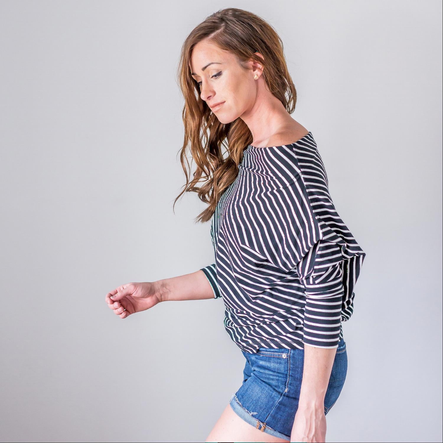 A stylish striped longsleeve off shoulder top featuring a boat neck design, long sleeves, and a comfortable fit, perfect for warm weather.